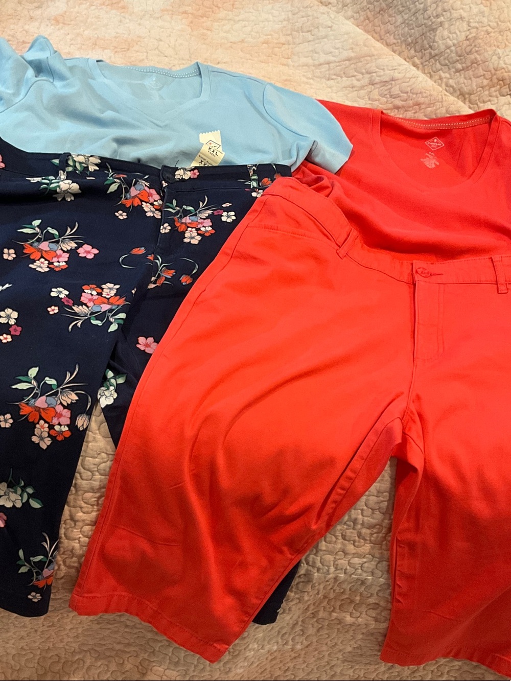 Coral Red V-Neck Top with Floral Navy Pants and Light Blue Tee